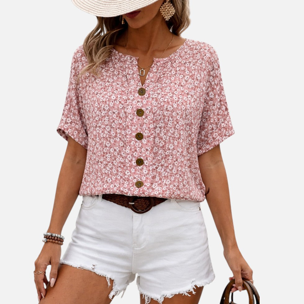 Damebluse med blomstermønster og knaplukning