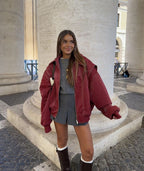 Damen Oversized-Steppjacke aus Kunstleder mit Kontrastnähten und Reißverschluss