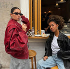 Damen Oversized-Steppjacke aus Kunstleder mit Kontrastnähten und Reißverschluss