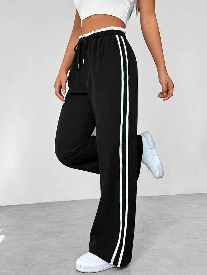 Damen Wide Leg Jogginghose mit Seitenstreifen und Kordelzug – Track Pants mit elastischem Bund