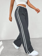 Damen Wide Leg Jogginghose mit Seitenstreifen und Kordelzug – Track Pants mit elastischem Bund