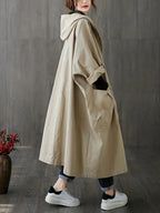 Damen langer Oversized-Kapuzen-Trenchcoat mit wasserabweisendem Material und aufgesetzten Taschen