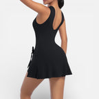 Women's sports dress with integrated shorts and tie waist