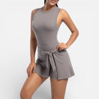 Women's sports dress with integrated shorts and tie waist