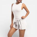 Women's sports dress with integrated shorts and tie waist