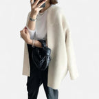 Long knitted cardigan with round neckline for women