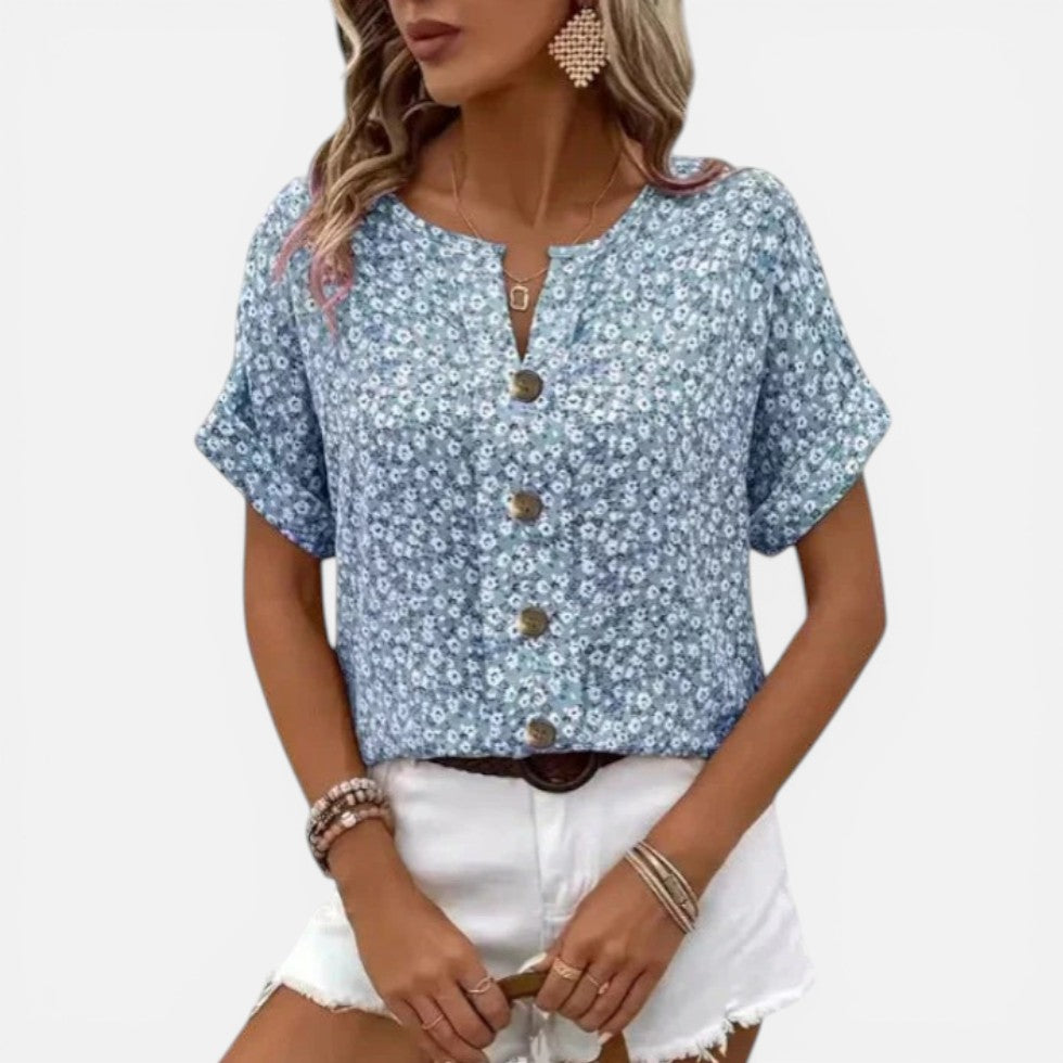Damebluse med blomstermønster og knaplukning